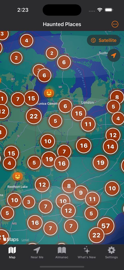 The app's map in Halloween mode: jack-o'-lantern pins over the Great Lakes